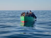 SAR MALTA, MALTA - 2023/02/15: Boat with 31 migrants seen minutes seen before they were brought to safety by the Spanish NGO Salvamento Maritimo humanitarian rescue team in SAR Malta waters on February 15. On Wednesday 15 February at around 15:00 hrs the rescue vessel Aita Mari of the Basque NGO SMH spotted a wooden boat of less than 5 metres floating in the Sar Malta Zone, at around 15:30 hrs the rescue began 33 miles off the coast of Tunisia to bring 31 sub-Saharan migrants to safety. (Photo by Ximena Borrazas/SOPA Images/LightRocket via Getty Images)