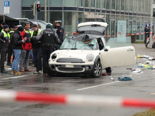 Vehicle Driven Into Crowd In Munich MUNICH, GERMANY - FEBRUARY 13: Police and emergency services operate near a damaged car th