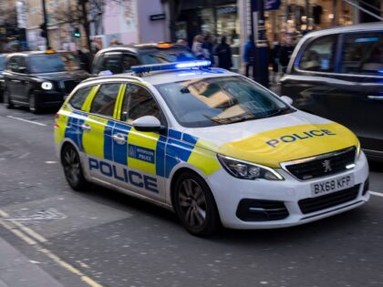Metropilitan Police car passing at speed with blue lights flashing on 18th February 2025 i