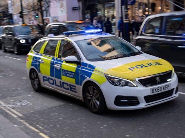 Metropilitan Police car passing at speed with blue lights flashing on 18th February 2025 i