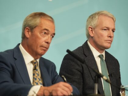 Reform UK leader Nigel Farage (left) with former Conservative MP Danny Kruger, who has def