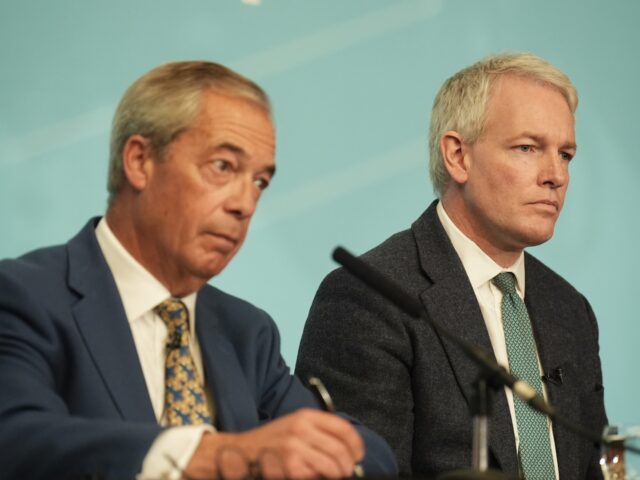 Reform UK leader Nigel Farage (left) with former Conservative MP Danny Kruger, who has def