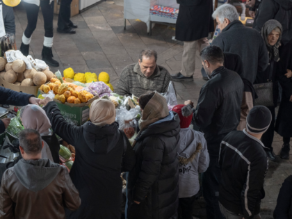 Iranian women shop for fruits and vegetables in the traditional Tajrish Bazaar in northern