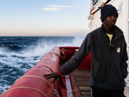 A migrant stands on the deck of rescue ship "Ocean Viking" operated by the NGO S