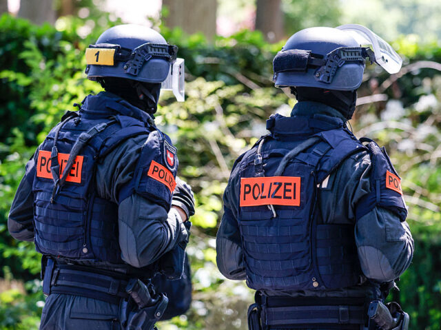 Police officers stand in front of the Verden Regional Court during the trial against Danie