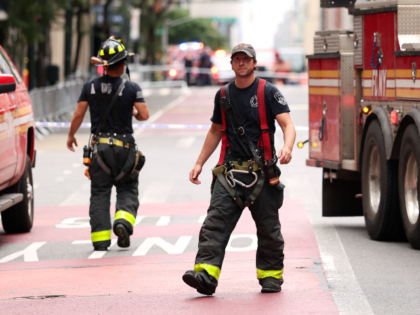 Firefighters from the New York City Fire Department (NYFD) respond to a building that has