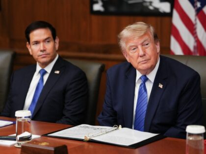 US President Donald Trump, alongside US Secretary of State Marco Rubio (L), speaks during