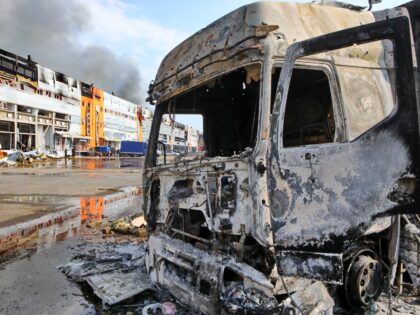 A burnt-out truck is at a logistics complex destroyed by a Russian missile strike in the v