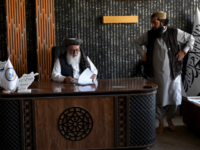 This photograph taken on July 27, 2026 shows Taliban Director of Mines in Badakhshan, Abdul Matin Rahimzai (C) during an interview with AFP at his office in Fayzabad, in Afghanistan's northeastern Badakhshan province. In Afghanistan's northeastern Badakhshan province, dozens of excavators operate day and night to extract gold from the mountains where villagers and their livestock once roamed. (Photo by Wakil KOHSAR / AFP via Getty Images)