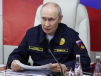 In this pool photograph distributed by the Russian state agency Sputnik, Russia's President Vladimir Putin holds a meeting onboard the Russian Navy's guided missile cruiser Varyag during the final stage of a Pacific Fleet's naval drills on far eastern Sakhalin Island on August 12, 2026. (Photo by Gavriil Grigorov / POOL / AFP via Getty Images)