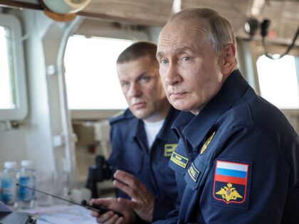 TOPSHOT - In this pool photograph distributed by the Russian state agency Sputnik, Russia&