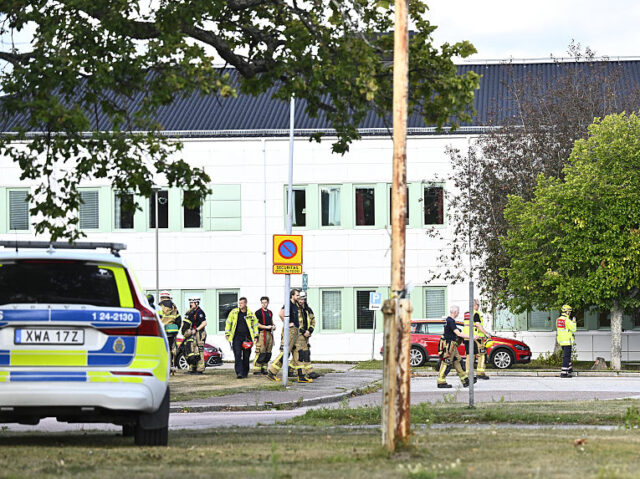SWEDEN-CRIME-SCHOOL Members of the emergency services work at the scene where an attacker with a sword wounded