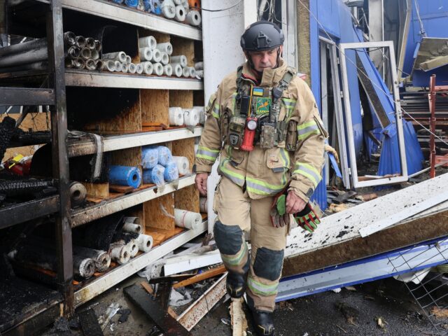 A rescuer works at an Epicenter hypermarket in the Osnovianskyi district, destroyed by a R