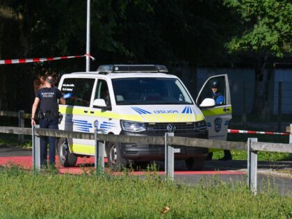 Police officers secure the area where a shooting occurred, in Aarau, northern Switzerland,