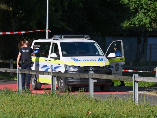 Police officers secure the area where a shooting occurred, in Aarau, northern Switzerland,