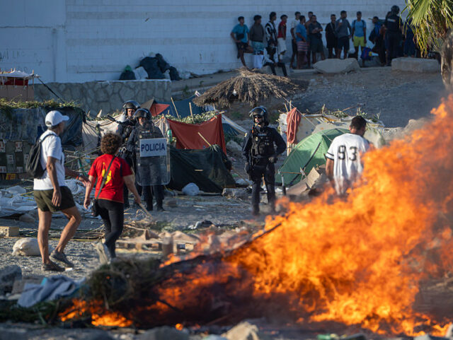 CEUTA, SPAIN - AUGUST 27: Street furniture and other items are set alight during a demonst