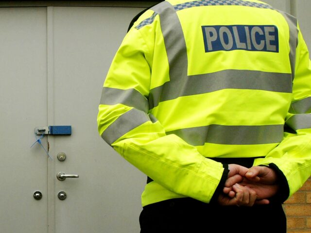 SOHAM, ENGLAND - NOVEMBER 10: Police stand in front of the door of the shelter where the c