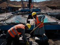 Workers handle the extraction process for chromium, a vital component of stainless steel, extracted from chromite inside the rocks gathered from the mountains nearby, at the Mughulkhil mine processing center in Logar Province, Afghanistan, Thursday, Sept. 1, 2022. Many mining operations are underway across the Afghanistan, which is believed to sit atop mineral deposits so vast that the Taliban is touting them as a panacea for countryÕs economic ills. Estimates value AfghanistanÕs deposits Ñ including those whose presence has only been extrapolated from survey data Ñ at anywhere from $1 trillion to $3 trillion. While some experts caution that those figures could be overstated, the potential revenues could fundamentally transform one of the worldÕs poorest nations. Those potential subterranean riches have also sent foreign powers such as China, Russia and Iran scrambling for a share Ñ but not the U.S., which officially refuses to deal with the rulers of the new ÒIslamic Emirate of Afghanistan,Ó who took charge after Western forces withdrew from the then-Afghan republic last year. (MARCUS YAM / LOS ANGELES TIMES)