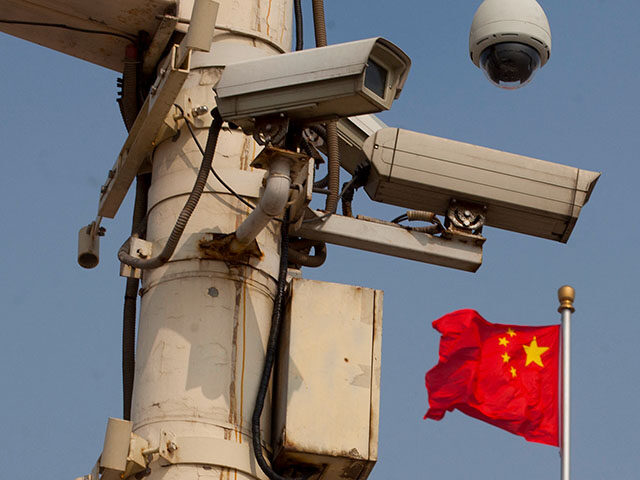 GettyImages145706127 The Chinese national flag flies behind security cameras on Tiananmen Square on June 4, 201