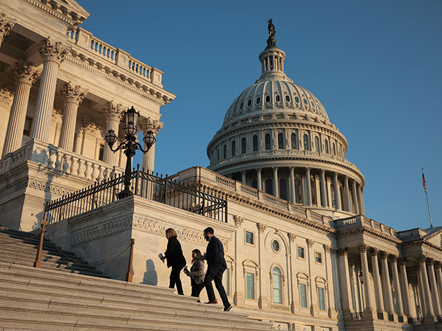 Members of the House walk up the steps outside the U.S. Capitol during the procedural vote