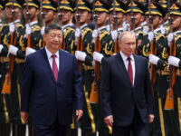 Russian President Vladimir Putin and Chinese President Xi Jinping inspect an honor guard during a welcoming ceremony at the Great Hall of the People on May 20, 2026 in Beijing, China. The two leaders are expected to reaffirm strategic ties between Russia and China amid ongoing Western pressure over the war in Ukraine. (Photo by Maxim Shemetov - China Pool/Getty Images)