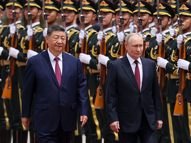 GettyImages2276661735 Russian President Vladimir Putin and Chinese President Xi Jinping inspect an honor guard d