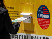 A person places their Mail in ballot into a ballot box during early voting outside of the LA County Registrar-Recorder building on Monday, June 1, 2026 in Norwalk, CA. (Ronaldo Bolaños / Los Angeles Times via Getty Images)