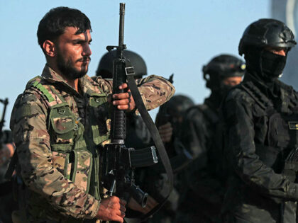Kurdish fighters from the Qamishli Brigade, part of the Syrian Democratic Forces (SDF) par