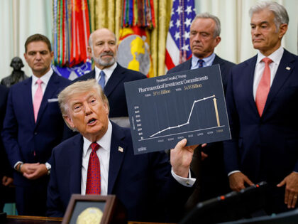U.S. President Donald Trump, accompanied by (L-R) Astellas Pharma President Michael Putras