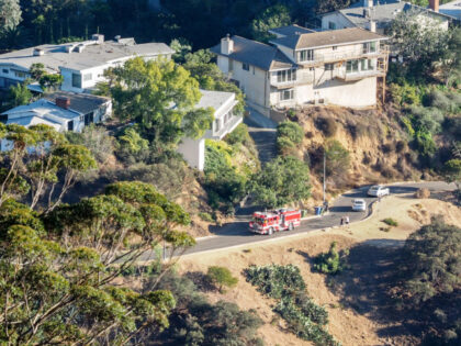 A house fire burns in the Hollywood Hills on September 25, 2016 in Los Angeles, California
