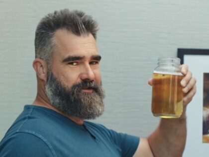 Jason Kelce holding his AI data center coolant