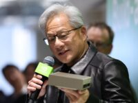 Jensen Huang holding an Nvidia box