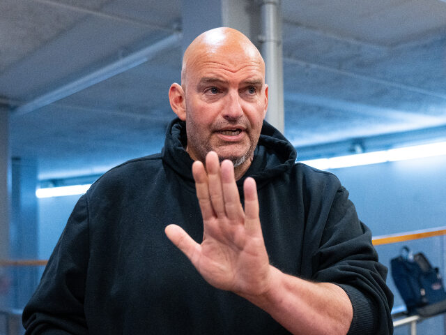 Sen. John Fetterman, D-Pa., speaks to reporters as he arrives in the U.S. Capitol for a vo
