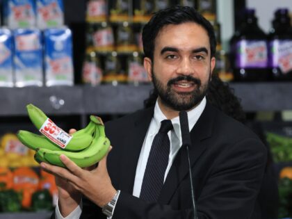 NEW YORK, NEW YORK - JULY 27: New York City Mayor Zohran Mamdani holds up bananas as he sp