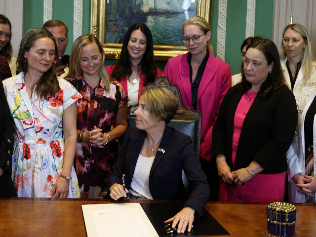 Massassuchetts Governor Maura Healey Massachusetts Governor Maura Healey turns to the women gathered behind her after signing a