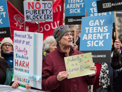 Demonstrators, campaigners and parliamentarians gather outside the Department of Health an