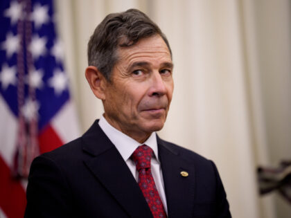Sen. John Curtis (R-UT) appears during an executive order signing with U.S. President Dona