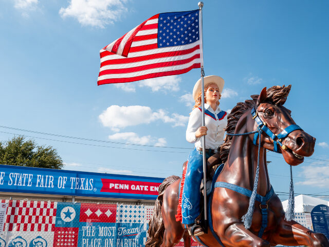 A statued horseback rider carrying an American flag is seen at the State Fair of Texas on