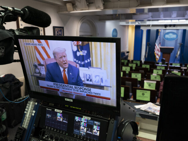 Trump Response to Impeachment U.S. President Donald Trump speaks during a recorded video on a television screen in the p