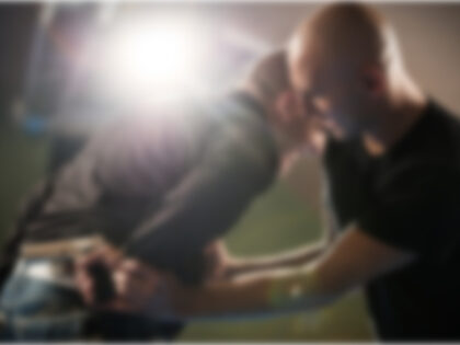 Two Men Wrestle for a Gun