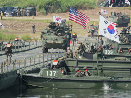 A vehicle from U.S. Army's the Stryker Combat Team crosses a floating bridge on the N