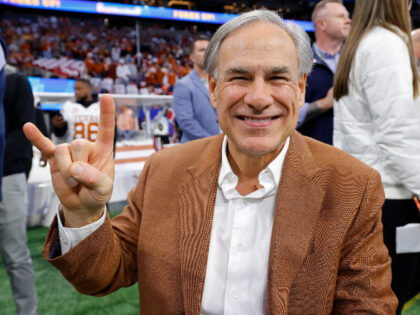 ATLANTA, GEORGIA - JANUARY 01: Texas Governor Greg Abbott poses on the field prior to the