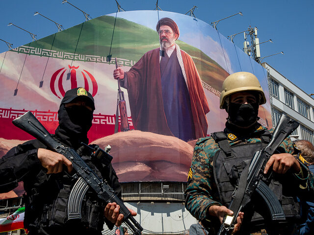 apr9-26-security-forces-Iran-Supreme-Leader-Mojtaba-Khamenei-getty TEHRAN, IRAN - APRIL 9: Members of the Iranian security forces stand guard under a large p