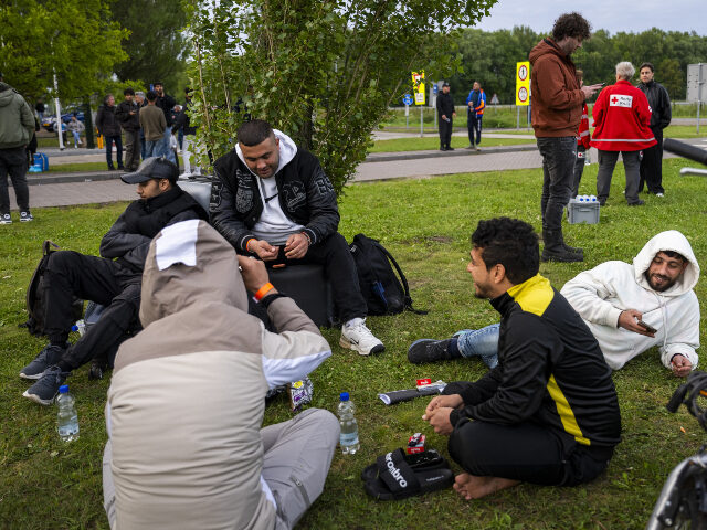 asylum seekers in Ter Apel, Netherlands Asylum seekers await at a registration center for news about a place to stay for the night