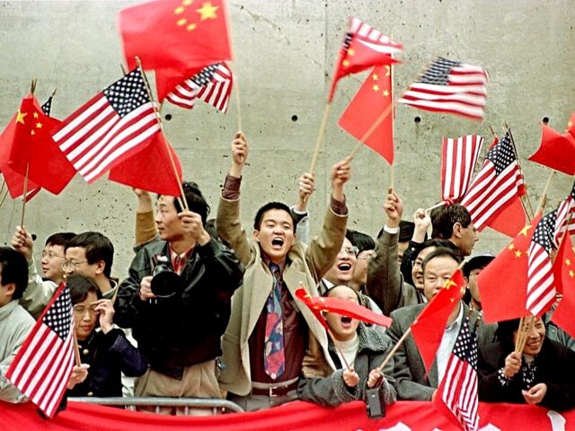 Several thousand people fill the streets around Harvard University for the visit of Chines