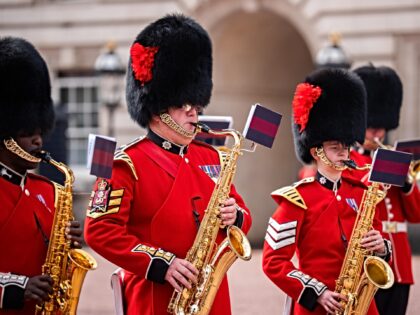 Members of the band of the Coldstream Guards and Welsh Guards play a tribute to singer Dol