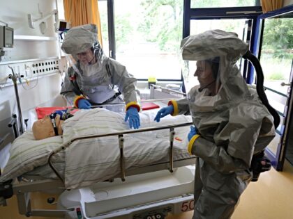 BERLIN, GERMANY - JUNE 09: Nurses dressed in personal protective equipment demonstrate the
