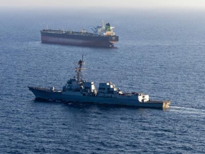 In this handout photo provided by U.S. Central Command, Arleigh Burke-class guided-missile