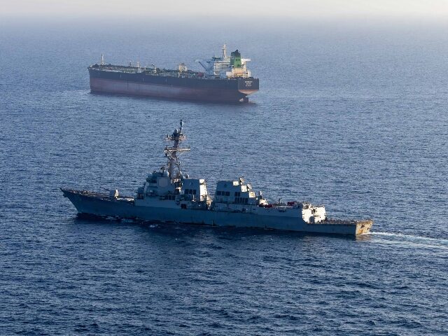 In this handout photo provided by U.S. Central Command, Arleigh Burke-class guided-missile