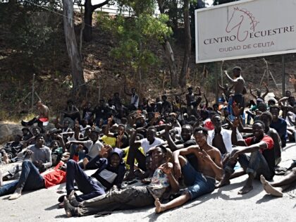 CEUTA, SPAIN - JULY 30: Dozens of people are waiting at the Temporary Immigrant Reception
